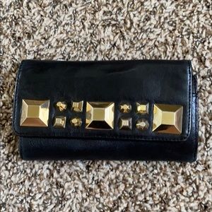 Black studded wallet.